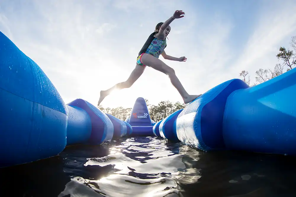 Running across the water park inflatables